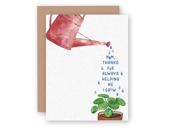 a mothers day card with a watering can and a plant