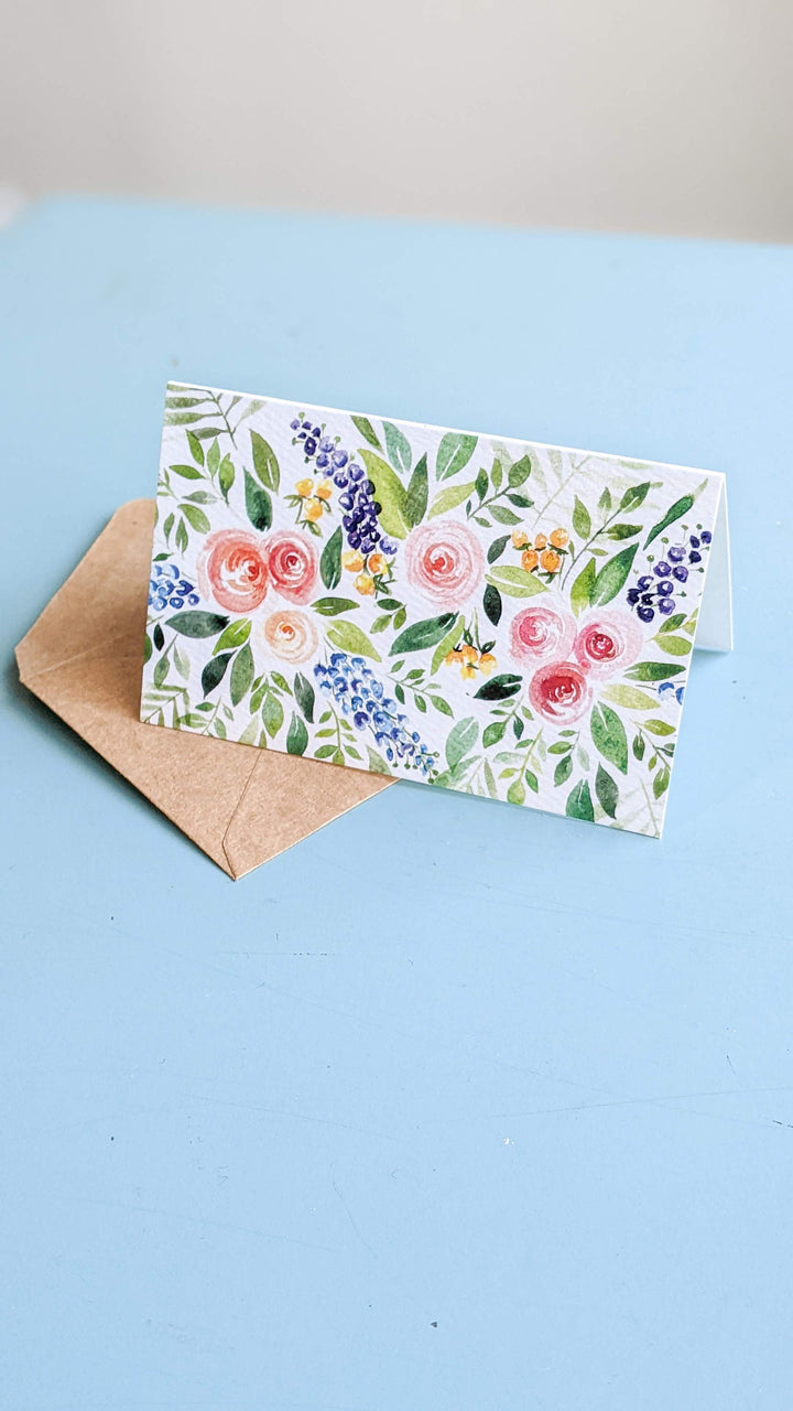 a thank you card with flowers on it