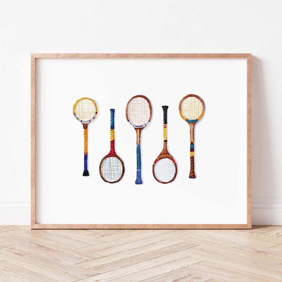 a picture of four tennis racquets on a white background