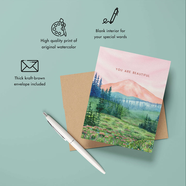 a greeting card with a mountain scene on it