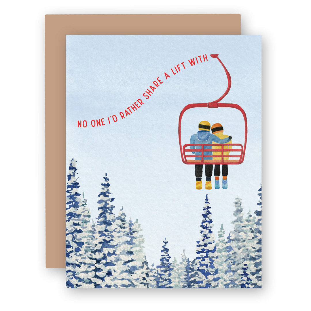 an anniversary card with two people riding a ski lift