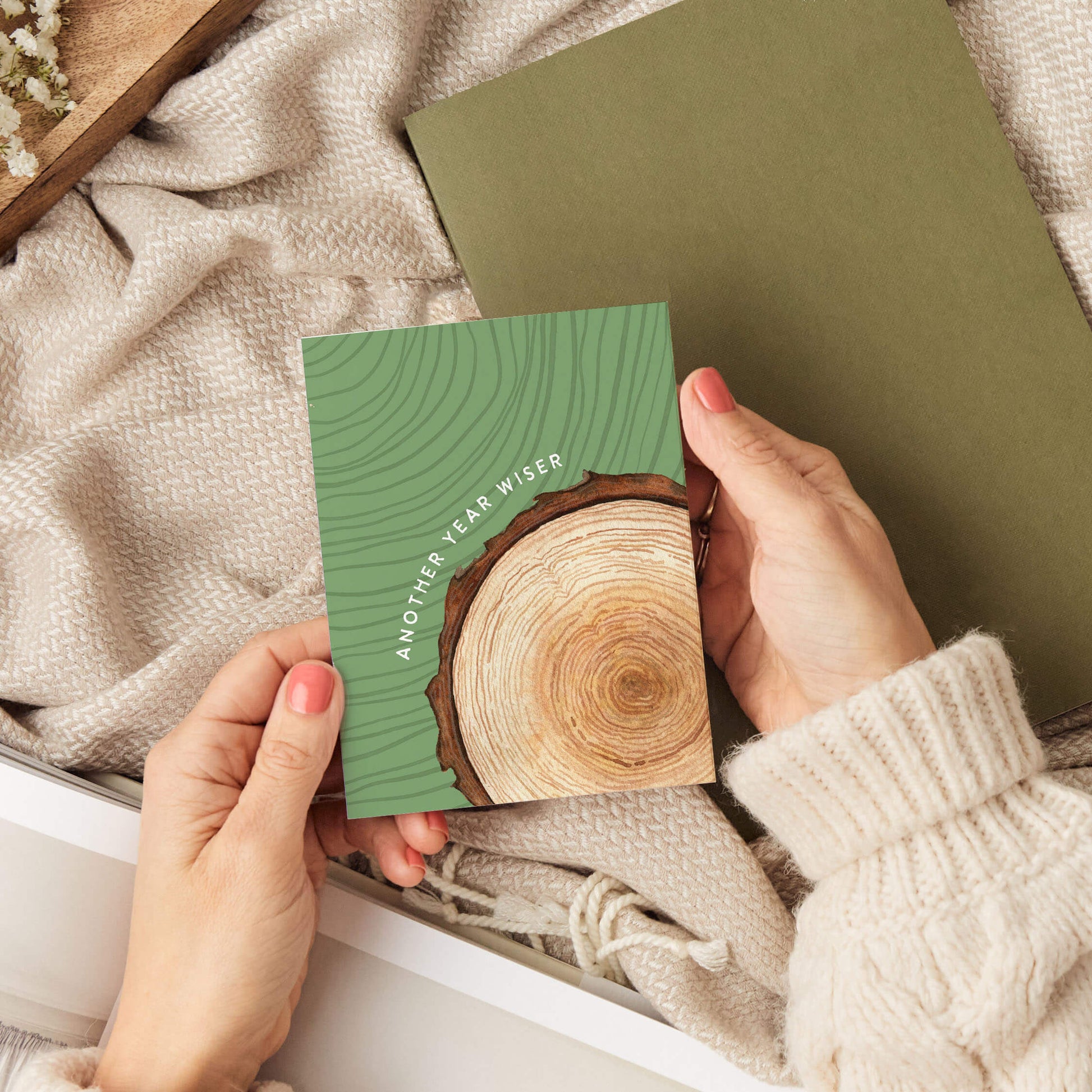 a person holding an outdoorsy birthday card