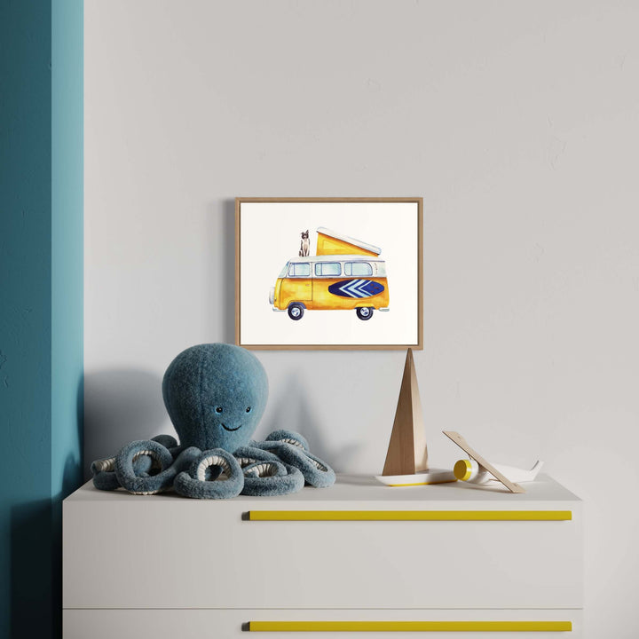 an octopus is sitting on a dresser next to a picture of a yellow vw adventure bus