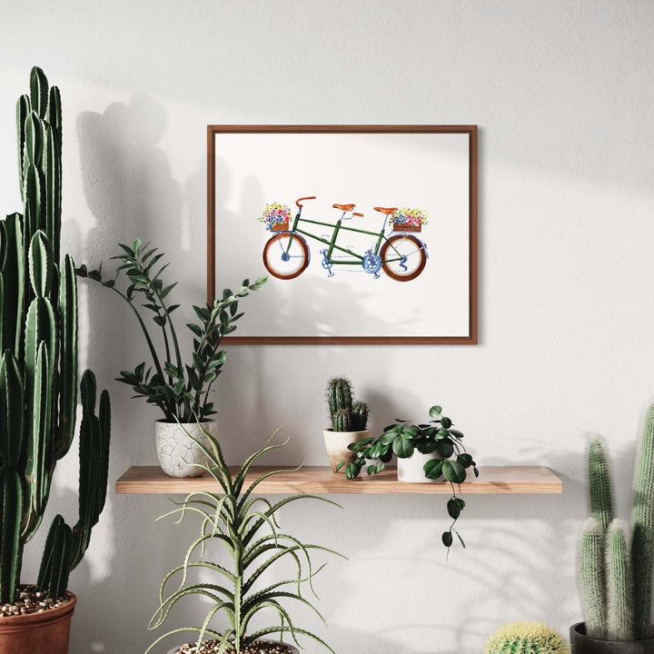 a picture of a bike on a shelf next to a cactus