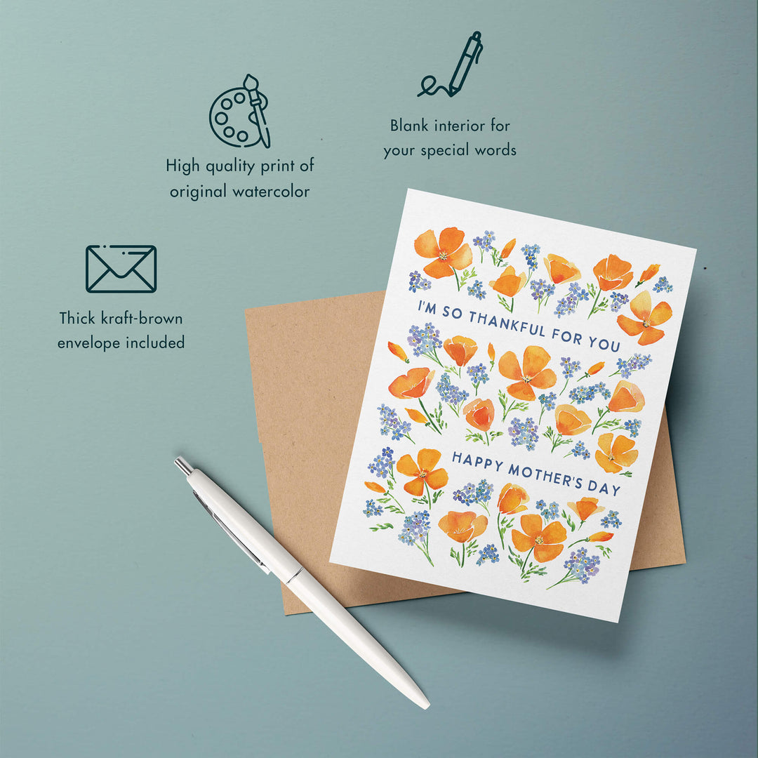 a greeting card with an envelope and a pen