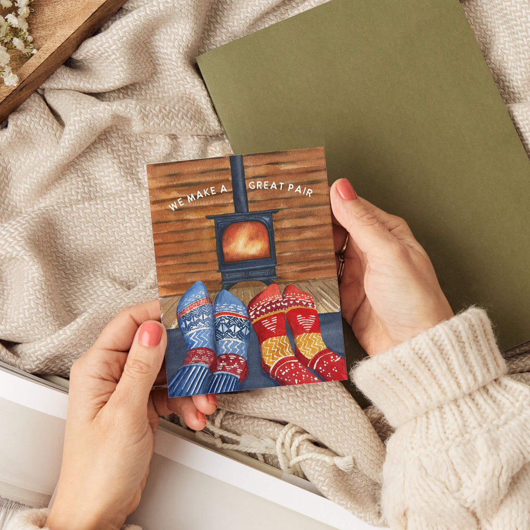 a person holding a card and a book