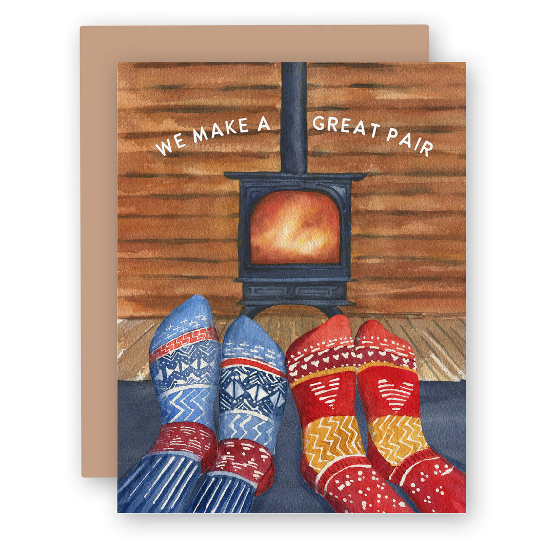 a card with a picture of a pair of slippers and a wood stove