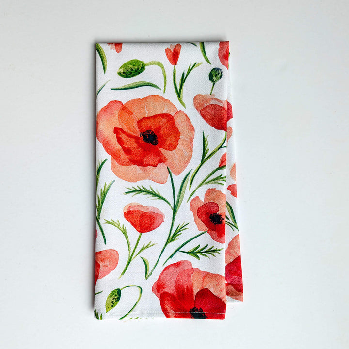 a napkin with a red flower pattern on it