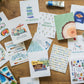 a table topped with lots of different hand painted cards