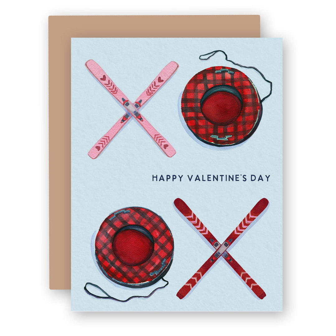 a valentine's day card with a picture of a couple of skis and