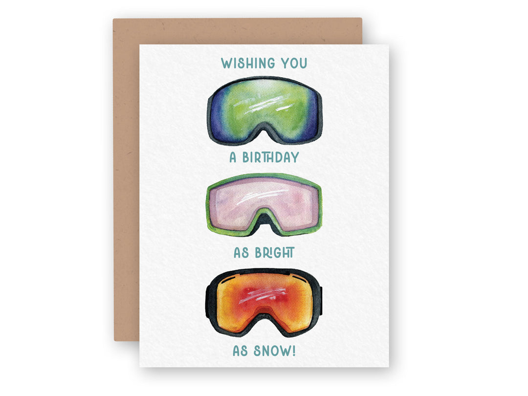 a greeting card with three ski goggles on it