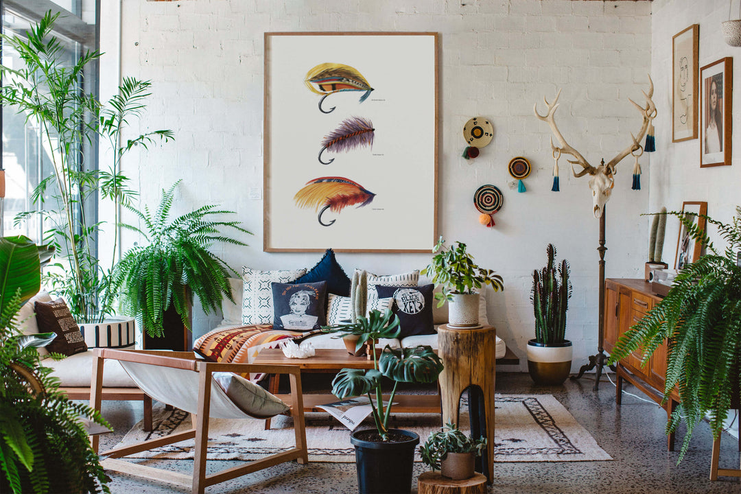 a living room filled with lots of plants and fly fishing decor