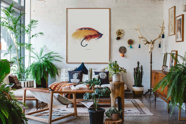 a living room filled with lots of plants and fishing themed decor