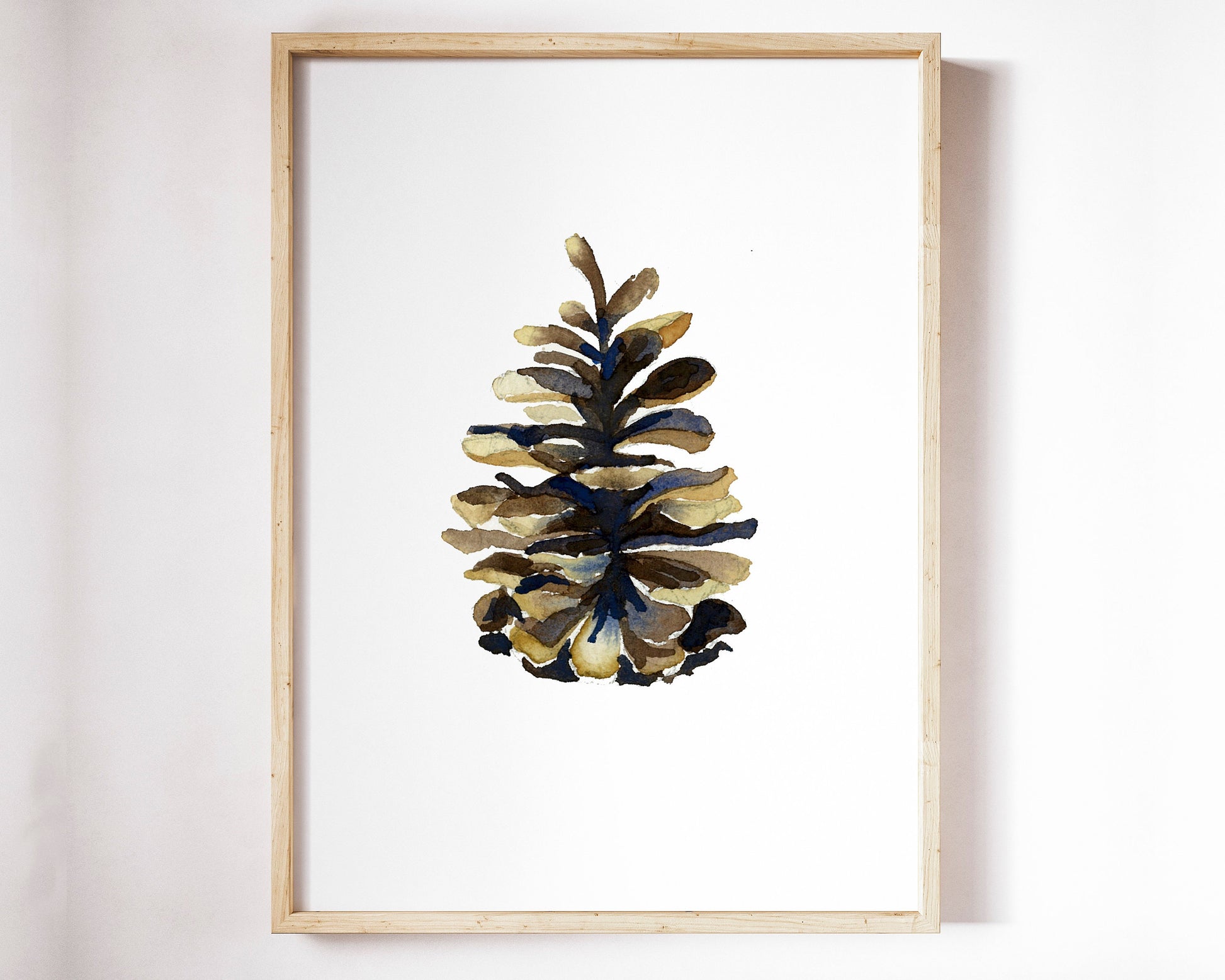 a framed art print of a brown pine cone
